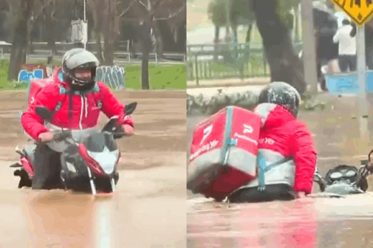 Repartidor de app se hace viral tras intentar cruzar calle completamente inundada en Talca