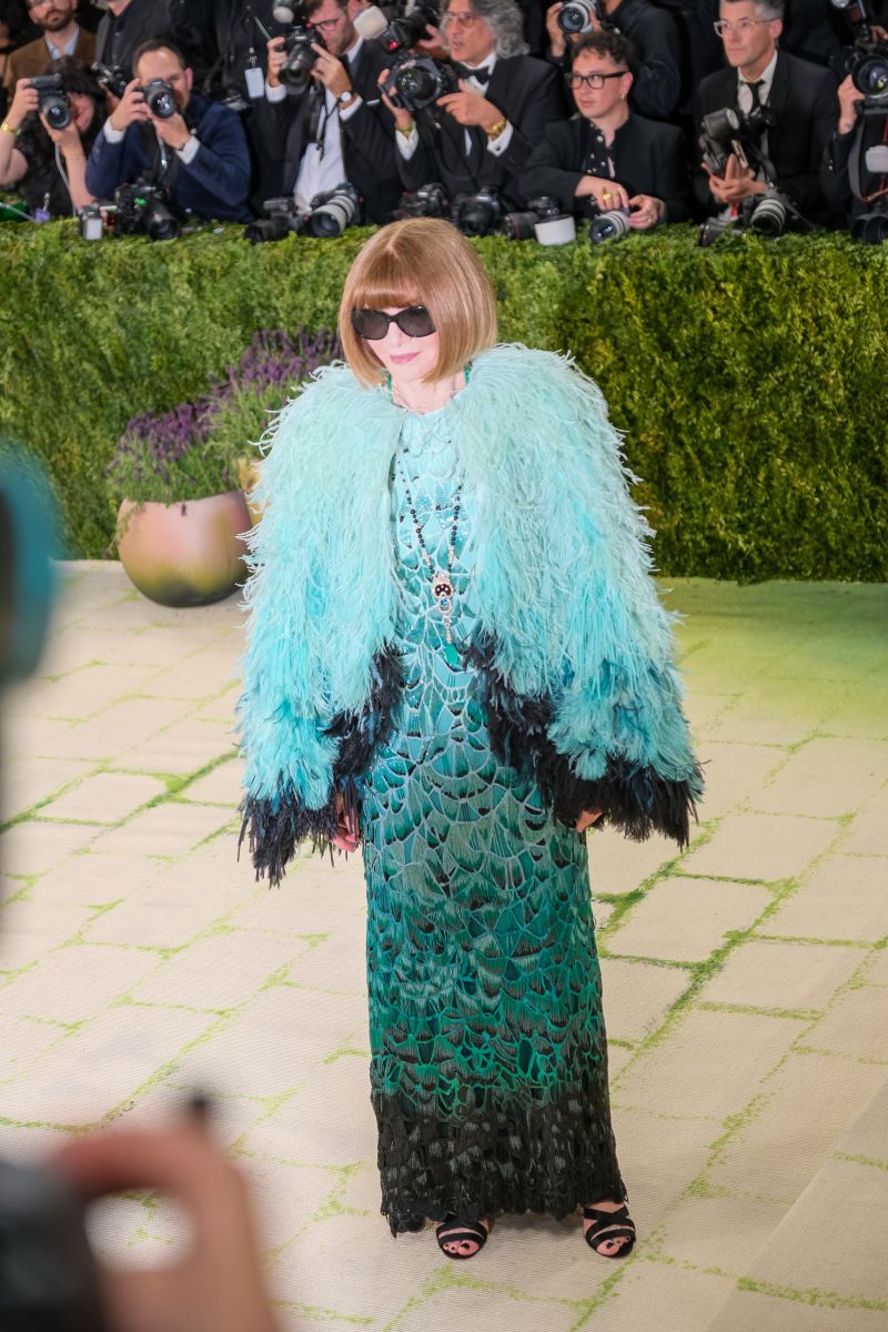 Anna Wintour arrives in a feathered Chanel ensemble. Lanna Apisukh for CNN