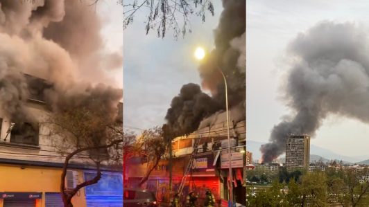 Incendio en Barrio Meiggs despliega amplio operativo de Bomberos y Carabineros en Santiago: Hay más de 15 locales afectados